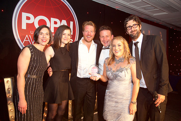 Tiffany Overstreet, Global Category Director at Essentra with the winners of P-O-P Display of the year